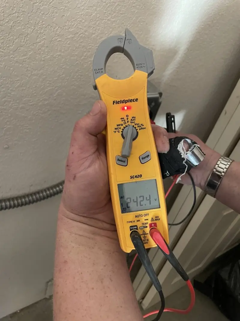 Voltage testing with clamp meter during Whole House Surge Protector in Linwood
